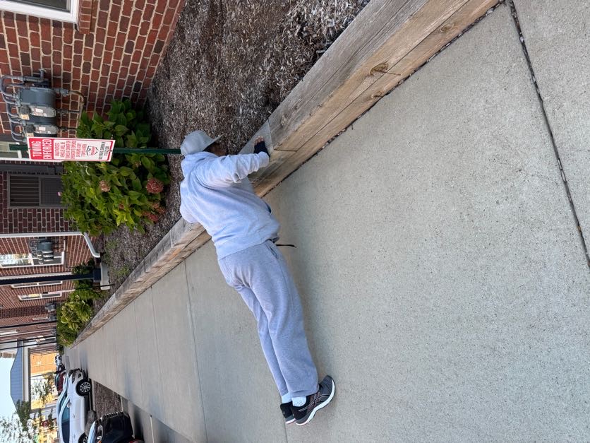 A GOD’S Walking Club participant doing an outdoor elevated push-up
